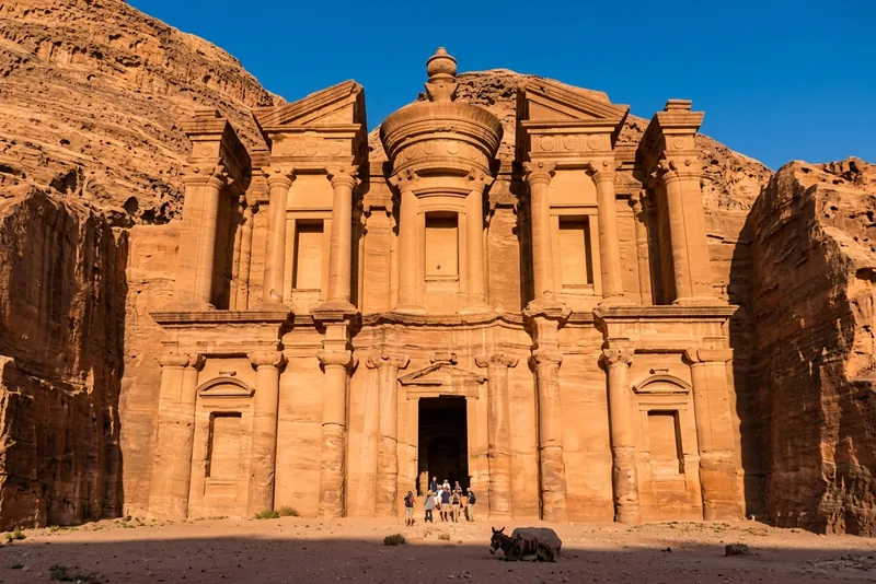The rock-cut facade of Ad Deir, the Monastery at Petra, in late afternoon sun
