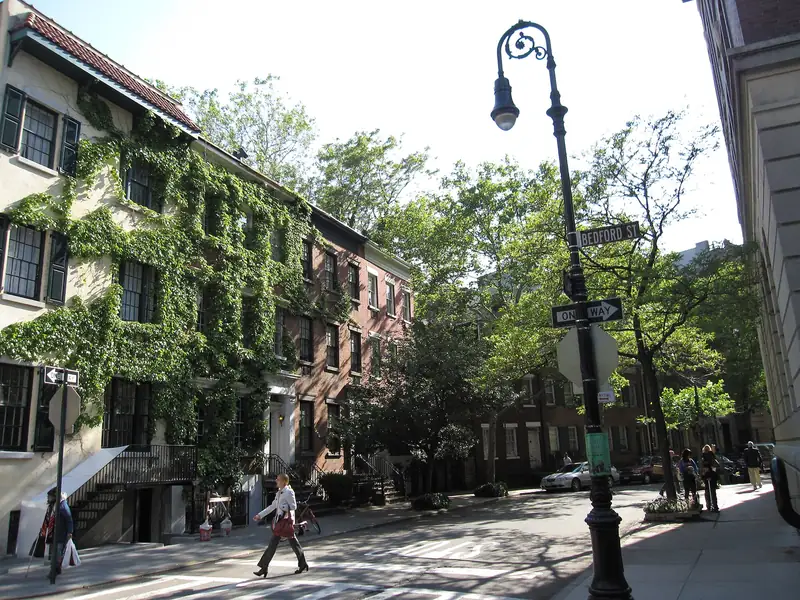 Corner of Grove Street and Bedford Street in Greenwich Village with ivy covered townhouses