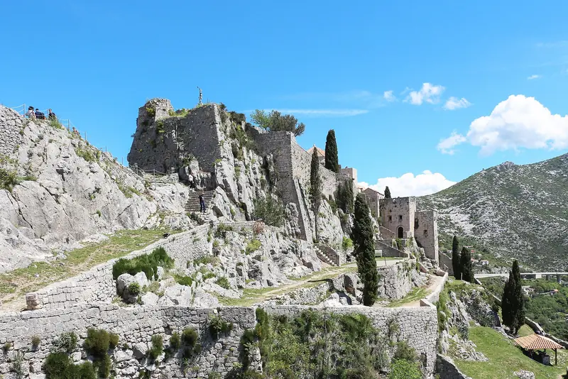Klis Fortress climbing a limestone ridge above Split