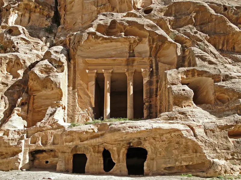 A columned Nabataean facade carved into the rock at Little Petra, Siq al-Barid