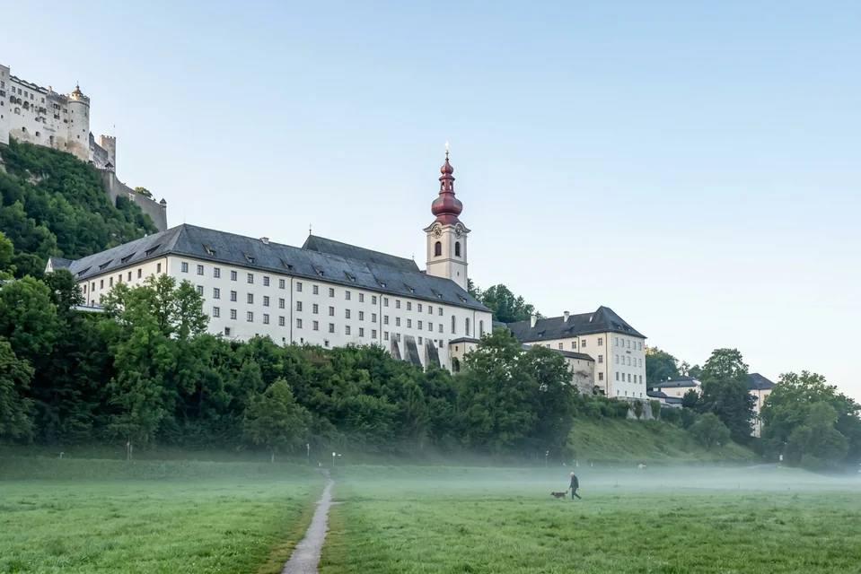 Nonnberg Abbey and its red onion-domed tower below the Hohensalzburg fortress in Salzburg