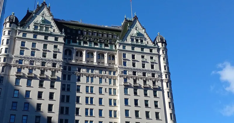 The Plaza Hotel facade with its green gabled roof at Grand Army Plaza