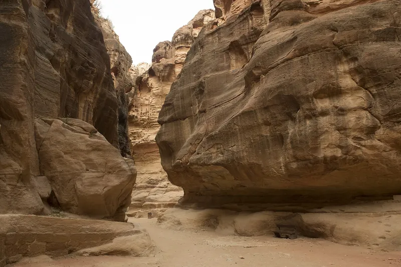 The narrow sandstone walls of the Siq, the gorge leading into Petra